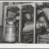 Milk cans coming out of sterilizer at the Dairymen's Creamery. Caldwell, Canyon County, Idaho