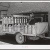 Truckload of milk-filled cans arrive at the Dairymen's Cooperative Creamery. Caldwell, Canyon County, Idaho