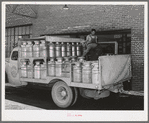 Truckload of milk-filled cans arrive at the Dairymen's Cooperative Creamery. Caldwell, Canyon County, Idaho