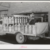 Truckload of milk-filled cans arrive at the Dairymen's Cooperative Creamery. Caldwell, Canyon County, Idaho