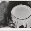 Cheese cloth strainer over milk cans on farm of member of the Dairymen's Cooperative Creamery. Caldwell, Canyon County, Idaho