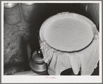 Cheese cloth strainer over milk cans on farm of member of the Dairymen's Cooperative Creamery. Caldwell, Canyon County, Idaho