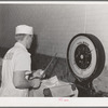 Weighing tubs of butter at the Dairymen's Cooperative Creamery. Caldwell, Canyon County, Idaho