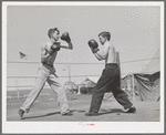 Boxing. Transient workers living at the FSA (Farm Security Administration) migratory farm labor camp. Athena, Oregon (mobile unit)