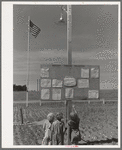 Children at the farm activities bulletin board at the FSA (Farm Security Administration) migratory farm labor camp mobile unit. Athena, Oregon