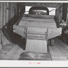 Wheat being emptied from truck into bin of wheat elevator. Eureka Flats, Walla Walla County, Washington