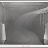 Bulk wheat being blown into railroad car for shipment to Spokane. Walla Walla County, Washington