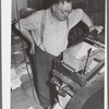 State inspector running dockage test on wheat. Walla Walla County, Washington