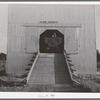 Truck which carries bulk wheat in entrance to private elevator. Touchet, Walla Walla County, Washington