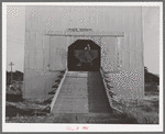 Truck which carries bulk wheat in entrance to private elevator. Touchet, Walla Walla County, Washington