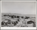 Eureka, Walla Walla, Washington. This was taken from top of elevator. Notice the sack warehouse along right of road