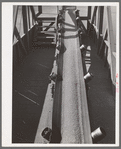 Bulk wheat is delivered from combine to truck. Wheat on conveyer belt being taken from elevator to barge for shipment to Portland. Walla Walla County, Washington