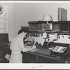 Office worker in wheat broker's office. Whitman County, Washington