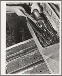 Farmer gets out tools to repair his tractor. Whitman County, Washington