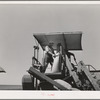 The sacker on combine in wheat fields. Whitman County, Washington