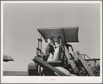 The sacker on combine in wheat fields. Whitman County, Washington
