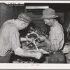 Repairing tractor, Colfax. Washington