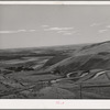 Highway leading down to the gorge at the Columbia River from the bench land. Klickitat County, Washington