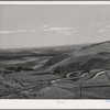 Highway leading down to the gorge at the Columbia River from the bench land. Klickitat County, Washington