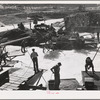 Indians fishing for salmon at Celilo Falls, Oregon. At the present time Indians have by treaty exclusive right for fishing in Columbia River which is adjacent to their reservation. This right is now being contested in lawsuits