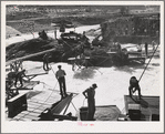 Indians fishing for salmon at Celilo Falls, Oregon. At the present time Indians have by treaty exclusive right for fishing in Columbia River which is adjacent to their reservation. This right is now being contested in lawsuits