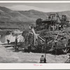 Indians fishing for salmon at Celilo Falls, Oregon