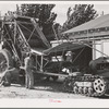 Repairing mechanical hop picker. Yakima County, Washington. This is the first year that the mechanical pickers were extensively used, they still have many "bugs" according to the growers