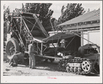 Repairing mechanical hop picker. Yakima County, Washington. This is the first year that the mechanical pickers were extensively used, they still have many "bugs" according to the growers