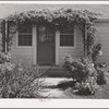 Front door of house for permanent farm workers at the FSA (Farm Security Administration) farm family migratory labor camp. Yakima, Washington