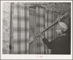 House cleaning, farmhouse. Yakima County, Washington