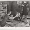 Cod liver oil and orange juice is fed to children at the nursery school at the FSA (Farm Security Administration) farm family migratory labor camp. Yakima, Washington