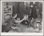 Cod liver oil and orange juice is fed to children at the nursery school at the FSA (Farm Security Administration) farm family migratory labor camp. Yakima, Washington