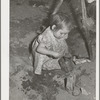 Little girl plays in sandpile. Yakima County, Washington