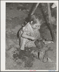 Little girl plays in sandpile. Yakima County, Washington