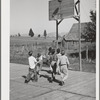 Basketball game. Children living at the FSA (Farm Security Administration) mobile camp for migratory farm workers. Odell, Oregon