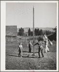 Playtime at the FSA (Farm Security Administration) mobile camp for migratory farm workers. Odell, Oregon