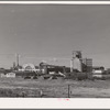 Warehouses and elevators on the waterfront of Astoria, Oregon. Fish and by-products, grain and lumber are shipped from this part