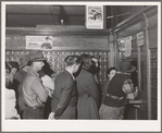 Line up at general delivery window in the post office at Hermiston, Oregon. This post office served about eight hundred people a year ago, now it has more than five thousand general delivery patrons