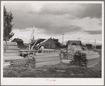 Sawing lumber to length for construction of sanitary units at the FSA (Farm Security Administration) trailer camp at Stanfield, Oregon. This camp will provide some housing for workmen at the Umatilla ordnance depot