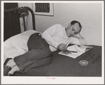 Workman at Navy shipyards, Bremerton, Washington in his room at the FSA (Farm Security Administration) dormitories