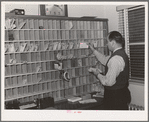 Mail racks for occupants of the FSA (Farm Security Administration) duration dormitories for workers at the Navy shipyards. Bremerton, Washington