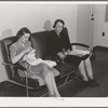 Women who work at the Navy shipyards in the community room for women at the FSA (Farm Security Administration) duration dormitories. Bremerton, Washington