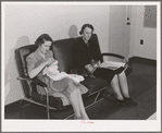 Women who work at the Navy shipyards in the community room for women at the FSA (Farm Security Administration) duration dormitories. Bremerton, Washington