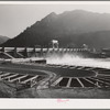 Gate controlled spillway dam and fish ladders in foreground at Bonneville Dam, Oregon