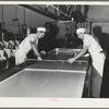 Breaking up curdling milk is one of the first steps of cheesemaking. Tillamook cheese plant, Tillamook, Oregon. This also distributes evenly the lactic ferment starter