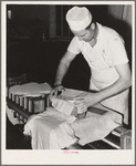 Putting curd into molds. Tillamook cheese plant, Tillamook, Oregon