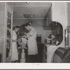 FSA (Farm Security Administration) dentist and nurse and migrant child in the FSA dental trailer at the FSA camp for farm families. Caldwell, Idaho