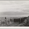 Spectators watch the contestants at cornhusking contest. Ontario, Oregon