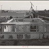 Black Canyon Project farmer builds house made possible by FSA (Farm Security Administration) special real estate loan. Canyon County, Idaho