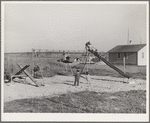 Children at play at the FSA (Farm Security Administration) camp for farm families. Caldwell, Idaho